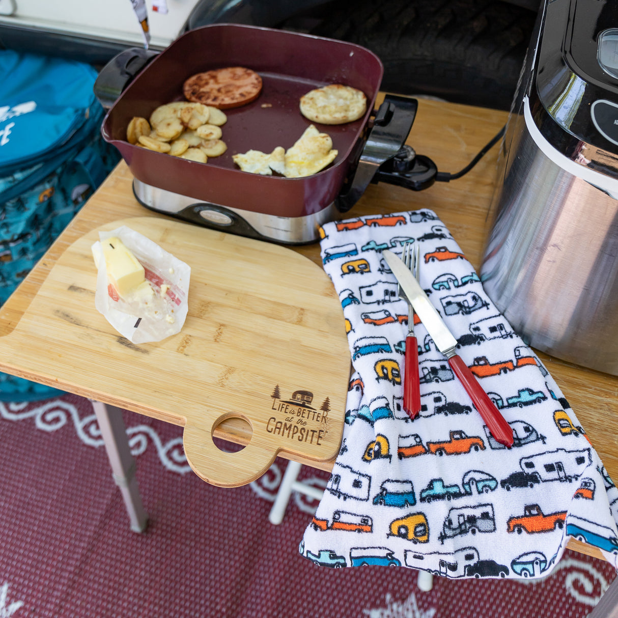 aerial shot of small side table set up in front of camper