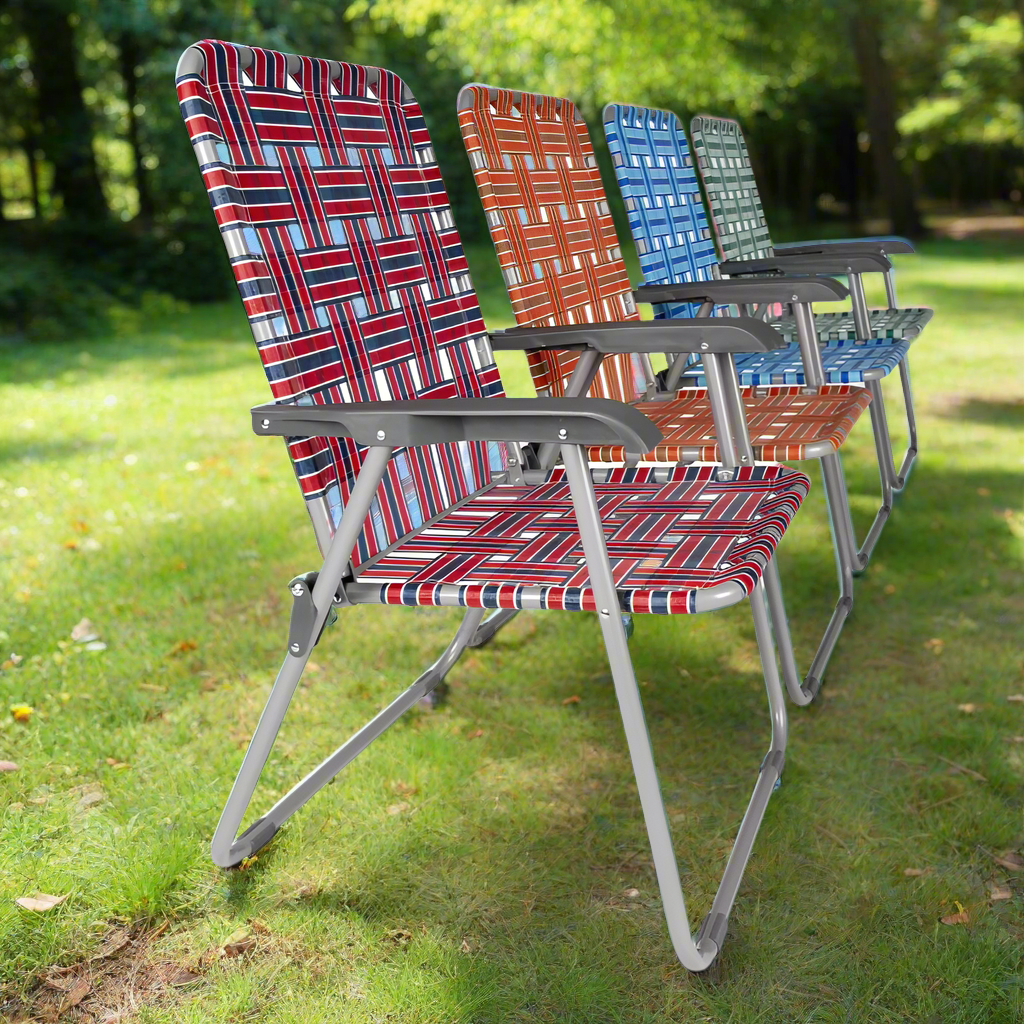 Four vintage retro-style camping chairs in a row, in the colours red orange blue and green