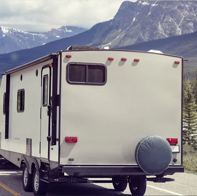 Air Conditioning unit installed on top of a motorhome travelling along a mountainous road highway